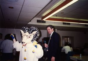 Suffolk University Athletics Director James E. Nelson with mascot Hiram the Ram at Spirit Day, 1989