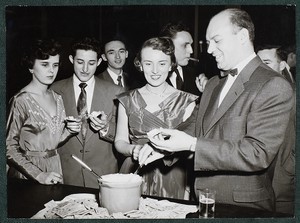 View of students at refreshment table during a social event