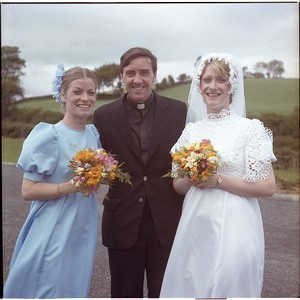 Fr. Sean Rogan with bride and bridesmaid? at Downpatrick. He later buried Bobby Sands, first hunger striker