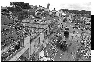 Damage from bomb in Main Street, Ballynahinch, Co. Down, caused by PIRA. Shots taken next day showing damage to surrounding property