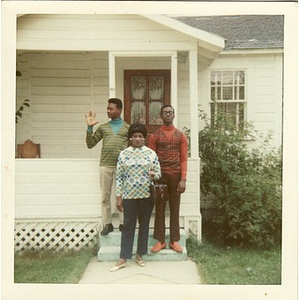 Stephen, David, and Inez Irving Hunter pose on the front steps