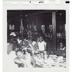 A group of young girls, seated in the dining hall at Breezy Meadows Camp