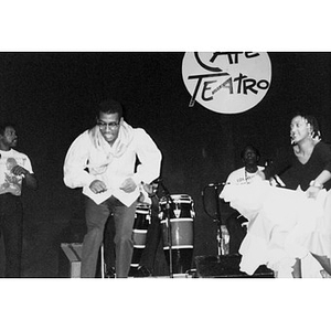 Los Muñequitos de Matanzas, a percussion, vocal, and dance ensemble from Cuba, on stage for a Café Teatro performance.