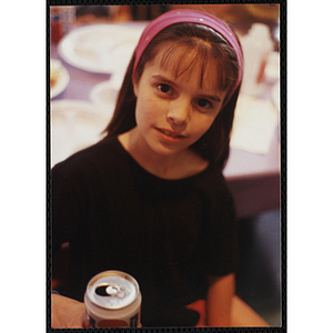 A girl wearing a headband poses for the camera at a Boys and Girls Club Awards Night