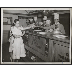 Members of the Tom Pappas Chefs' club work the line in a kitchen