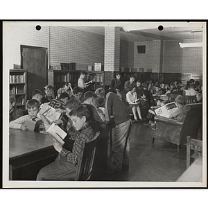 Boys fill a reading room in a library