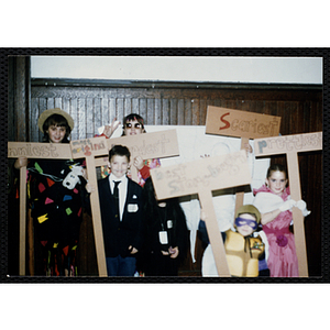 Winners of assorted Halloween costume contests, including "Funniest," "Weirdest," "Most Original," "Best Store-Bought," "Scariest," and "Prettiest," pose for a group shot