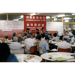 Suzanne Lee addresses a rooom of people gathered for a Chinese Resident Association celebration