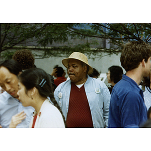 Chinese Americans and other Bostonians attend a rally for Long Guang Huang at City Hall Plaza in Boston