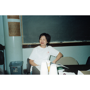 Woman at a Chinese Progressive Association meeting