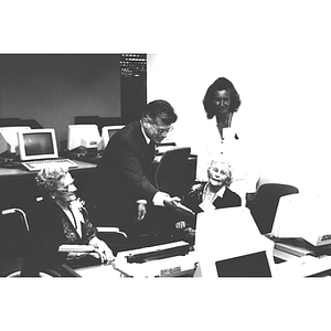 Dean of University Libraries, Alan R. Benenfeld, points to a computer at the dedication of Snell Library