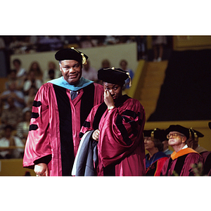 Donna Harris-Lewis accepting honorary Doctor of Humanities hood on behalf of her deceased husband, Reggie Lewis