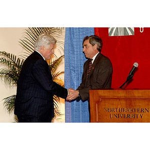 U.S. Senator Edward Kennedy (D-MA) shakes the hand of Northeastern's President Richard M. Freeland at a press conference on student aid