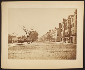 Urban view of Beacon Street at Charles Street with entrance to Boston Public Garden