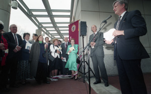 Dedication ceremonies for the Conte Polymer Center: David K. Scott addressing the crowd (view toward the crowd), John Olver in background