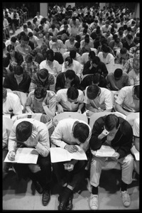 Students taking the Selective Service College Qualification examination to determine eligibility for an educational deferment from service in the Vietnam War