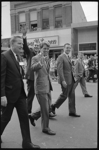 Robert F. Kennedy and entourage walking past the Youthtown store, Worthington, during the Turkey Day festivities