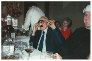 Sidney Lipshires at Congress of Connecticut Community Colleges Christmas party, wearing Groucho glasses