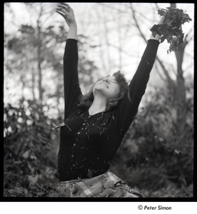 Lucy Simon throwing leaves