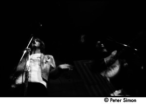 The Byrds and Flying Burrito Brothers performing at the Boston Tea Party: Gram Parsons and Roger McGuinn playing guitar (partial double exposure)