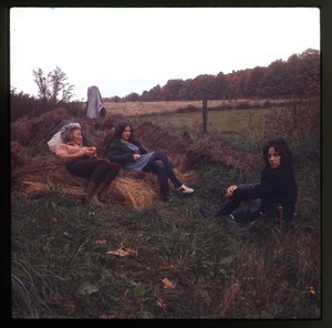 Nina Keller (center), her mother, and unidentified woman sitting in field, Montague Farm Commune