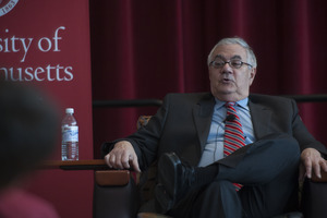 View from the audience of Congressman Barney Frank seated on the Student Union Ballroom stage, UMass Amherst, during his book event