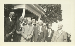 Members of the class of 1888 pose in front of the home of Mr. and Mrs. Field at a reunion in June, 1938. Jonathan E. Holt is on the bald man on the left in a dark suit, and Herbert Loomis has a short beard and is in the back row