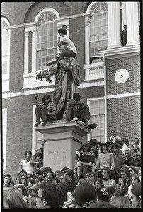 Demonstration at State House against the killings at Kent State: protesters on statue of Horace Mann