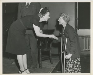 Two women shaking hands