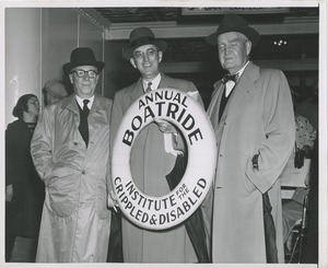 Bruce Barton and men with annual boat ride sign