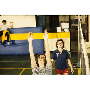 Woman reaching her arms up during a game of volleyball