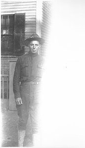 A man in army uniform in the Back Central Street neighborhood.