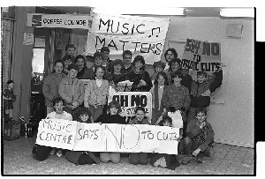 Group of young musicians protesting proposed music funding cutbacks by government