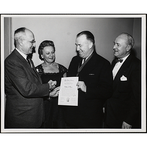 Walter A. Brown, Overseer of the Boys' Clubs of Boston, receives the Boys' Club Bronze Keystone Award