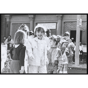 A group of girls stand in front of the Eben D. Jordan Memorial Building at the Boys and Girls Clubs of Boston 100th Anniversary Celebration Street Fair