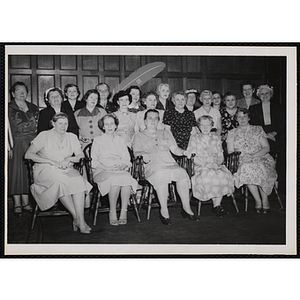 Women pose for a group portrait at a Mothers' Club event