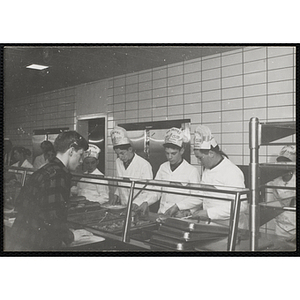 Members of the Tom Pappas Chefs' Club serve diners in a Brandeis University dining hall