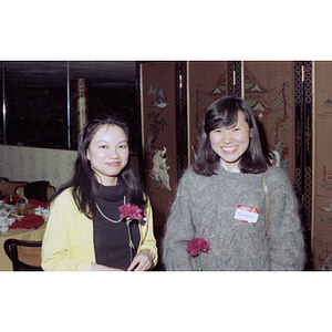 Two women attend a celebration of the Chinese New Year