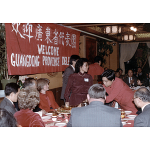 Suzanne Lee stands with members of the Guangdong Province delegation at a welcome gathering