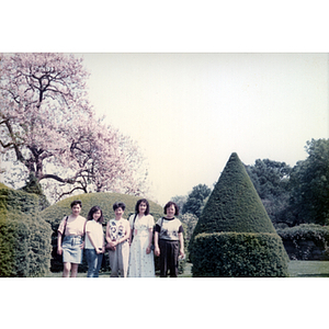 Five women stand in a topiary garden in Philadelphia's Longwood Gardens