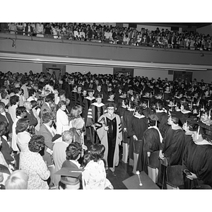 Professor Raymond Robinson leads the procession at the fall commencement of 1975