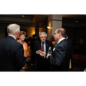President Aoun conversing with a group of guests at NU Night at the Pops