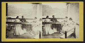 Four people sitting on a porch, Concord, Mass., undated