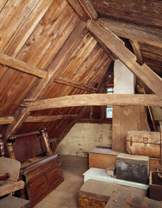 Attic showing stored trunks and furniture, Coffin House, Newbury, Mass.