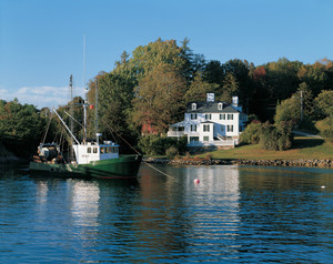 Viwe of exterior from the estuary with a boat in the foreground, Sayward-Wheeler House, York Harbor, Maine