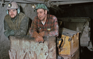 Gold miners in rail conveyor