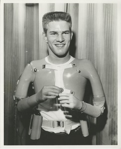 Unidentified man demonstrating his prosthetic arms