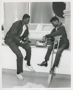 Men listening to records on boat ride