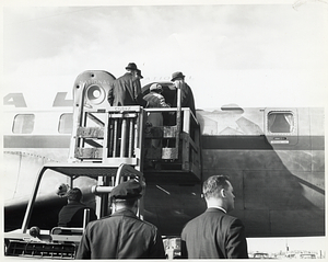 Unidentified men and woman boarding plane