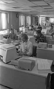 Unidentified call center workers in Boston Police Dispatch Operations Center